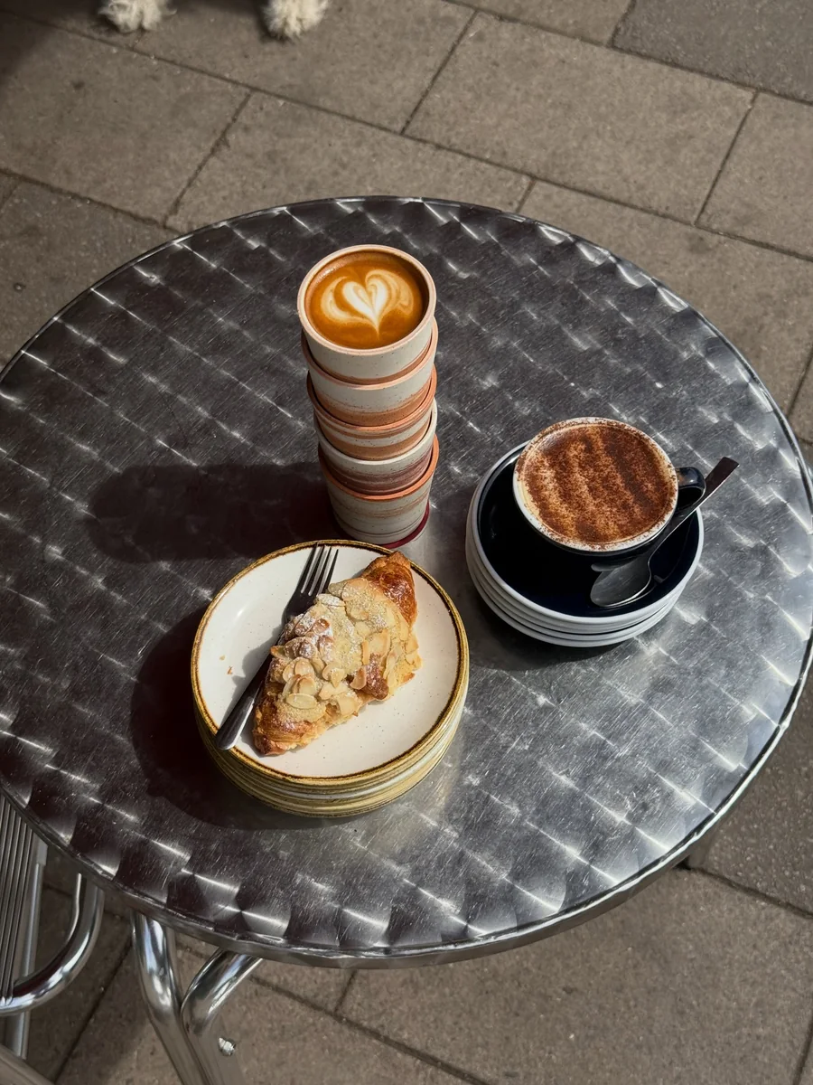 Hot chocolate and a croissant outdoors