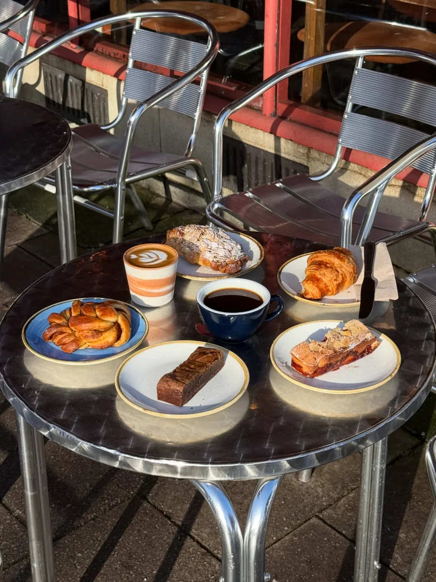 Coffee and pastries on an outdoor table